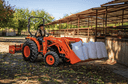 Man hauling heavy materials with front loader