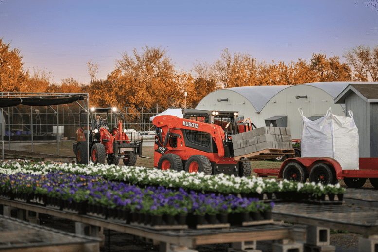 Skid steer moving cinder blocks