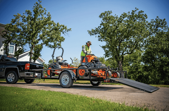User riding the SZ Series model off of trailer