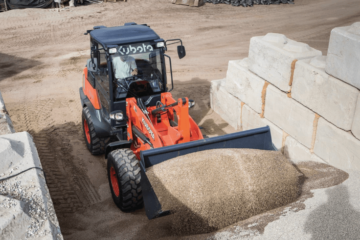 Wheel Loader moving gravel with bucket