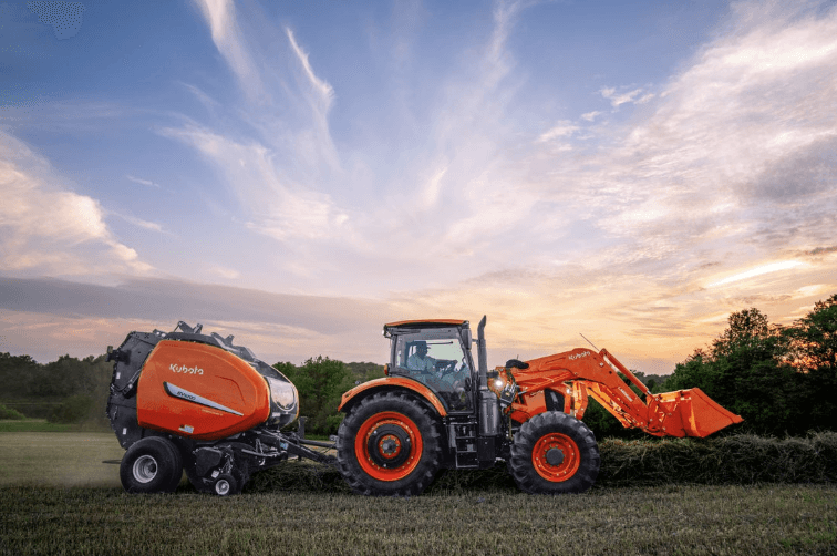 Tractor pulling hay baler