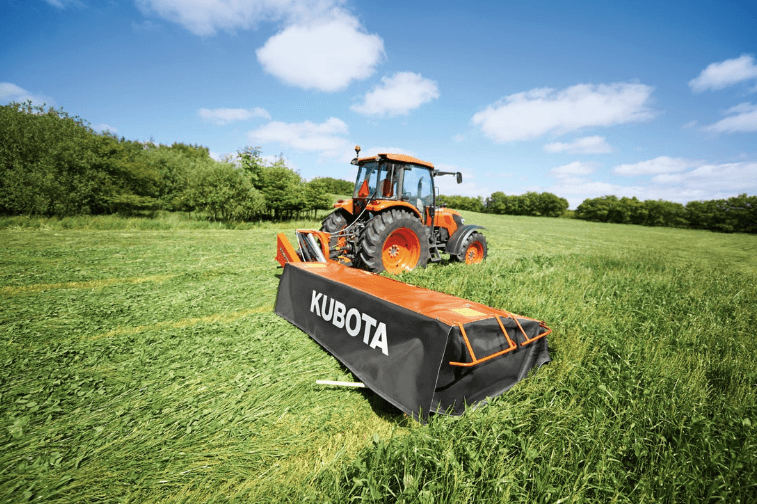 Tractor using disc mower