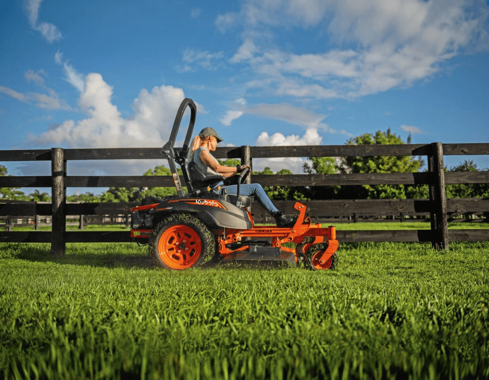 woman operating kubota zero turn mower
