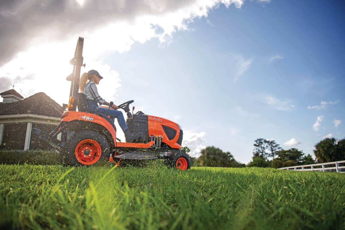 woman mowing with BX1880