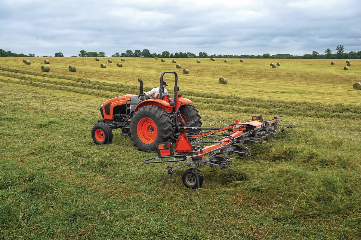 Kubota Tractor hauling a Kubota Rake