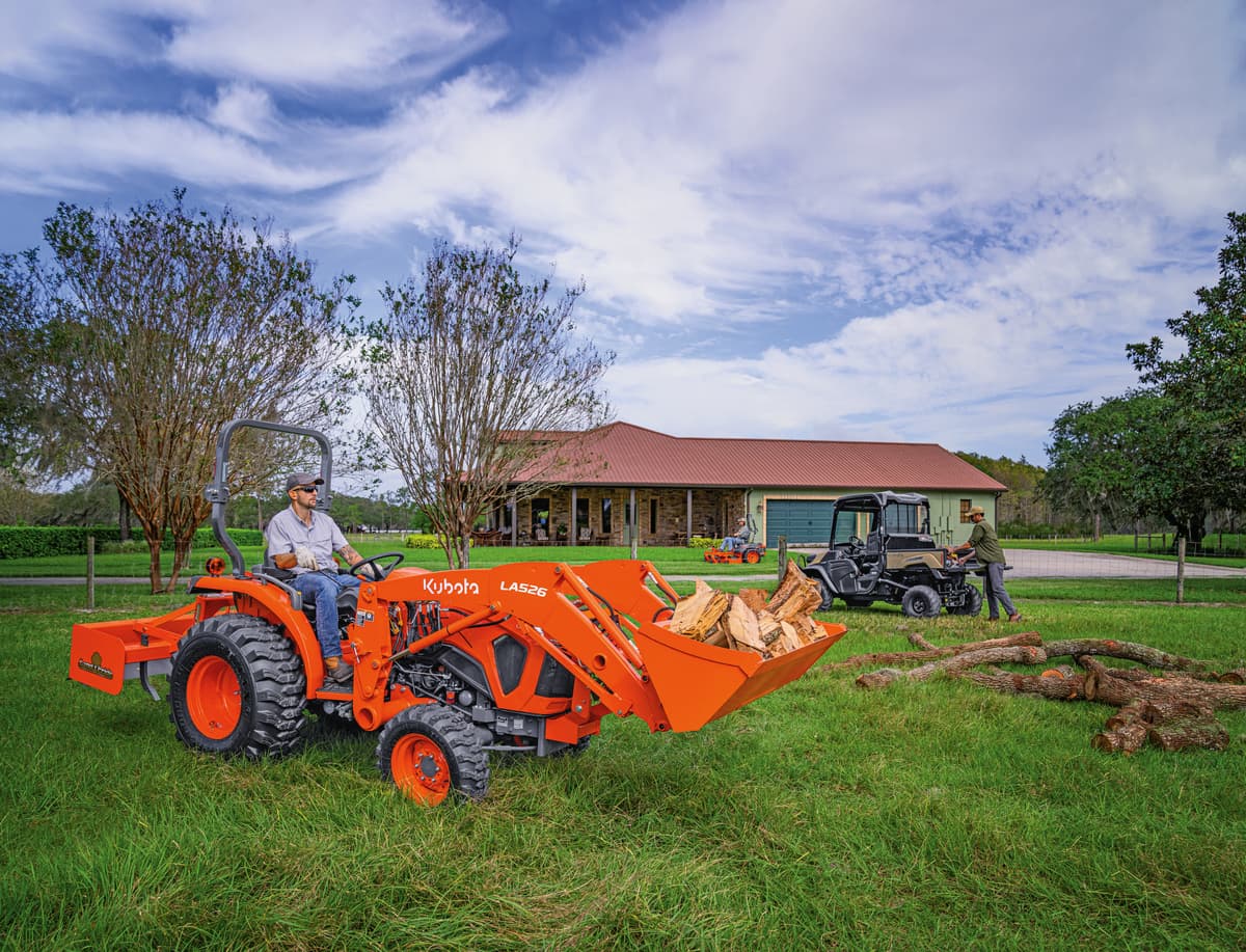 L2502 moving chopped wood